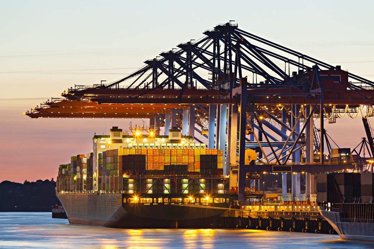 Container ship at a terminal at dusk